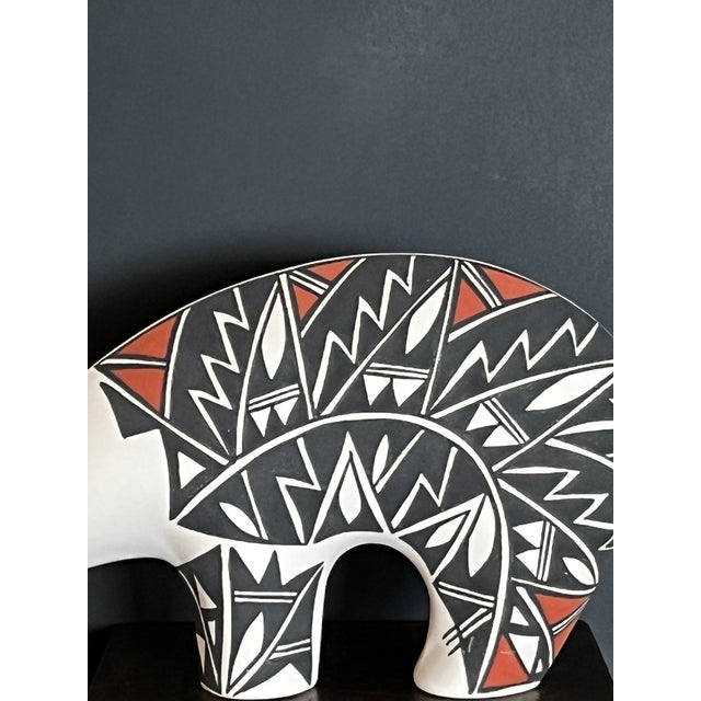 This impressive 12-inch wide hand-coiled bear sculpture is a masterful example of contemporary Acoma Pueblo artistry....