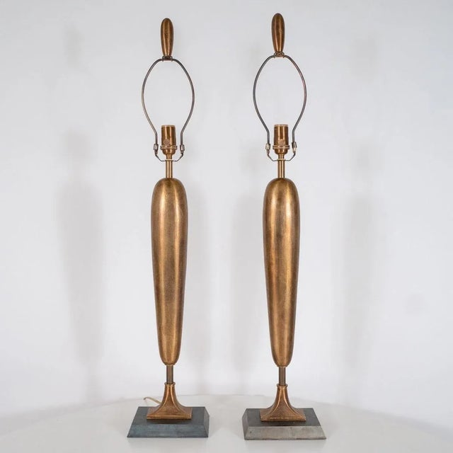 Pair of brass Deco inspired table lamps with bronze finish. Origin: United States Circa: 1960s Dimensions: 7" wide x 5"...
