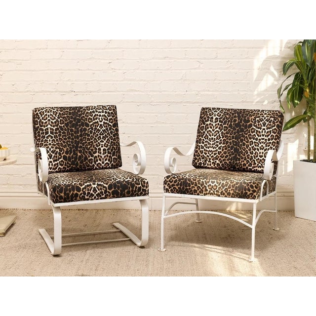 A wildly fun vintage lounge chair upholstered in an allover leopard print, paired with a sculptural white frame. The...