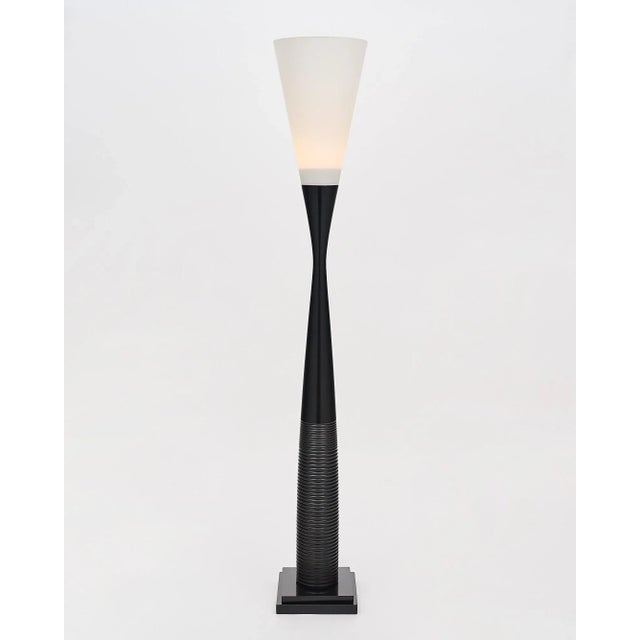 Pair of Art Deco Totem floor lamps from France. Each light features a turned wood base with the classic Art Deco details....