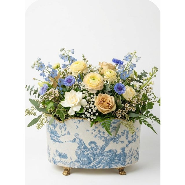 A sweet pretty blue and white metal toilet wall papered elongated cache planter pot. This is such a pretty feminine pot....