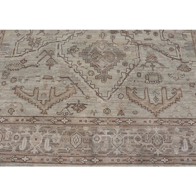 Measures: 8'9 x 11'7 Finely made Tabriz design Rug in a Soft Taupe Field and Accents in Brown and delicate details 8'9 x...