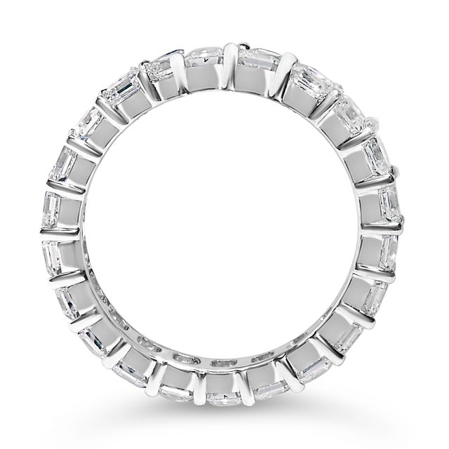 Envelop your finger in a ribbon of radiance with this 14K white gold eternity band, a testament to enduring charm and...