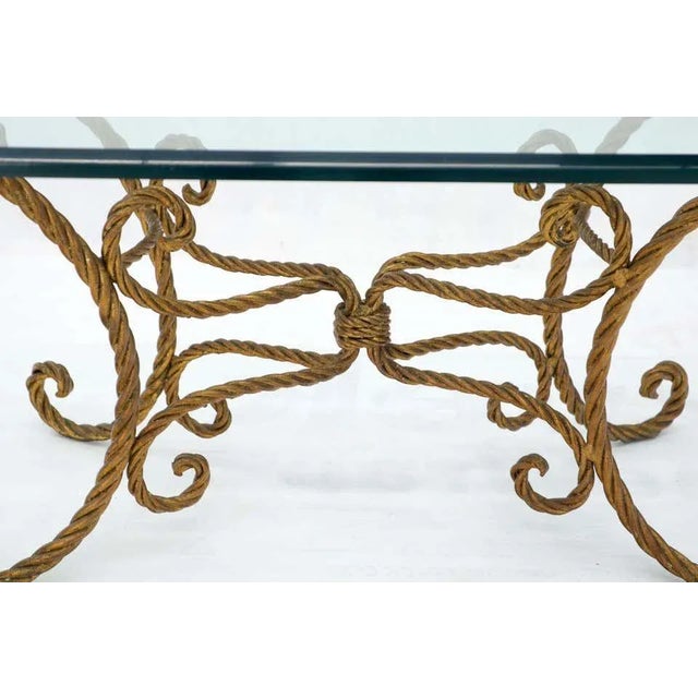Beautiful gold.gilt wrought iron rope twist coffee table. Very elegant.