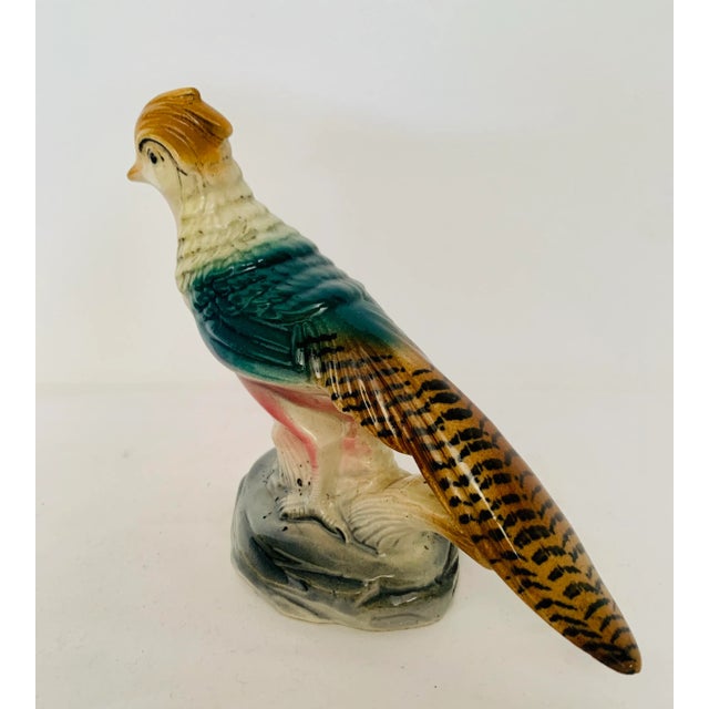 Vintage, very detailed figurine of a pheasant on a tree stump. Perfect decoration for the table top or in a bookcase.