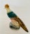 Vintage, very detailed figurine of a pheasant on a tree stump. Perfect decoration for the table top or in a bookcase.