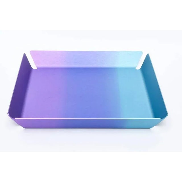 The glorious colors that fade into one another of purple, blue and turquoise/blue was done for Art Basel 2016 by an artist...