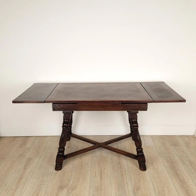 A French country draw leaf table in walnut, circa 1880. Can seat four or six. Width when opened is 62.5"; knee clearance...