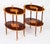This is a wonderful vintage pair of flame mahogany and satin wood oval etagere tables, dating from the late 20th century....