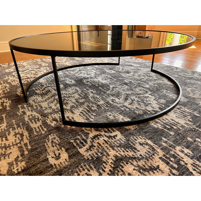Great condition black/dark gray contemporary round glass coffee table. Glass is sealed in, not removable. Purchased...