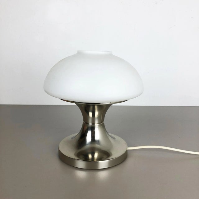 Article: table light with opal shade Origin: Italy Decade: 1970s This original vintage light was designed and produced in...