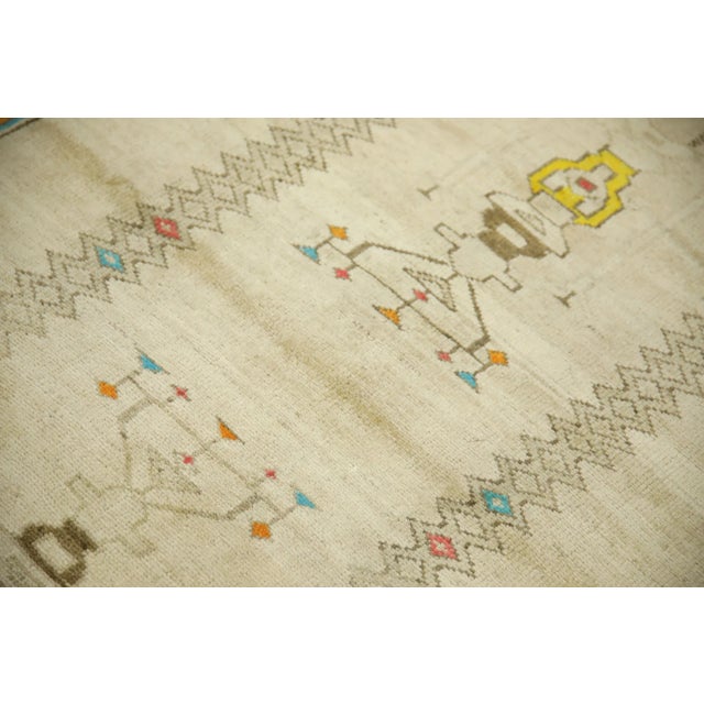 Introducing a one-of-a-kind vintage Turkish hand-knotted wool rug, carefully crafted by skilled artisans using traditional...