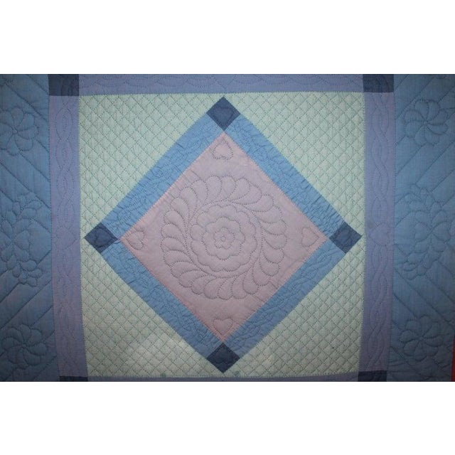 Amish mounted diamond in a square crib quilt from Lancaster County, Pennsylvania. This rare and very unusual all cotton...