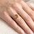 Bask in the warm, sun-kissed glow of this magnificent three-stone cocktail ring, a masterful combination of modern...