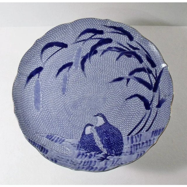 Blue Chinese Quail footed cake plate/server, in the Imari style. Plate has a quail and cattail design with hand-painted,...