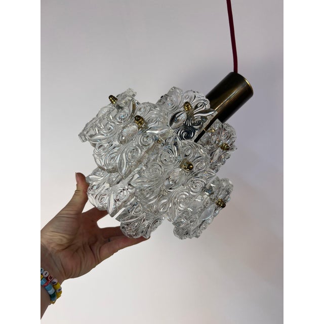 This pendant lamp from the 1960s, made by the premium German manufacturer Kinkeldey, is a truly dazzling masterpiece of...