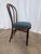 This vintage bentwood chair features a classic Thonet-style design with elegantly curved wooden elements and a rounded...