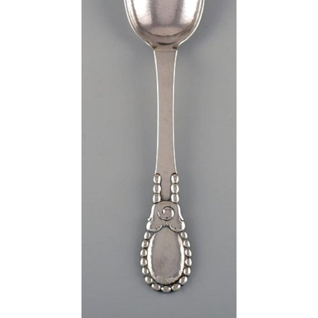 Evald Nielsen number 13 large tablespoon in hammered silver, 830. Dated 1924. Measures: Length 21 cm. Stamped. In...