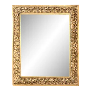 A Nineteenth Century Continental Relief and Gilt Carved Mirror.