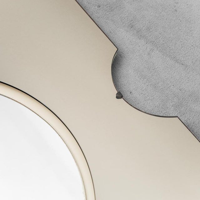 Wall mirror. Smoked glass frame. Produced in the 1970s. In good condition, with signs of wear mainly around the edges....