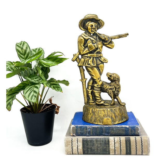 Charming 20th century brass hunting figure modeled after Victorian English doorstops, featuring a young huntsman with...