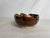 A brilliant earthy bowl. Created by artist Flynn Sochon, this beautiful piece would add visual interest and texture to any...