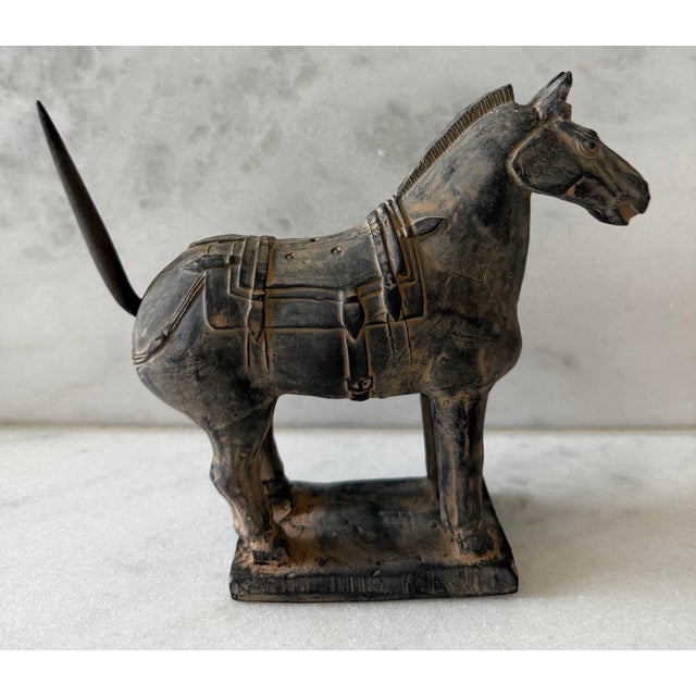 Vintage terra cotta horse figurine, crafted as a replica of the Qin Dynasty warrior horses discovered in the tomb of...