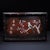 A beautifully crafted Chinese rectangular tray or display stand, made of dark Zitan wood. The piece features a low gallery...