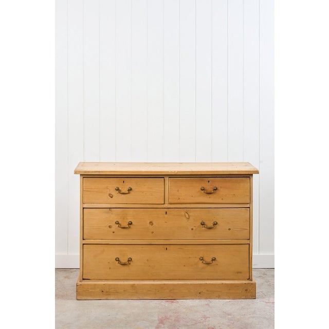 This pine 2 over 2 dresser base/server has a charming rustic look with a natural honey-toned finish. The piece is solid...