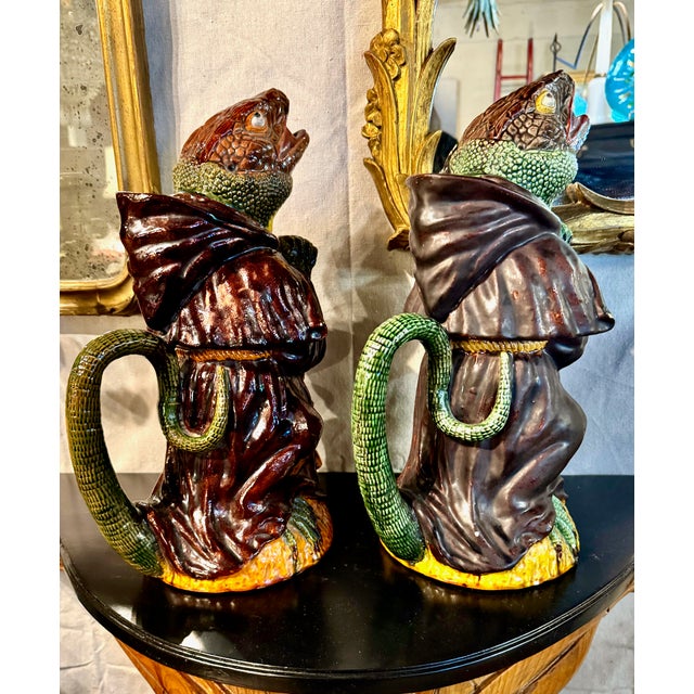 These are a near pair of rare Portuguese Majolica of Caldas da Reina jugs or pitchers created by the important majolica...