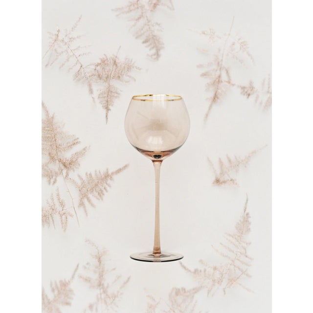 Set of 4 white wine goblets in Fawn with gold rim. Sleek stem, bulbous mouth, 16 oz. Neutral tones bring subtle warmth and...