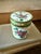 This charming vintage Canton enamel covered box features hand-painted pink peony blossoms accented by green foliage and...