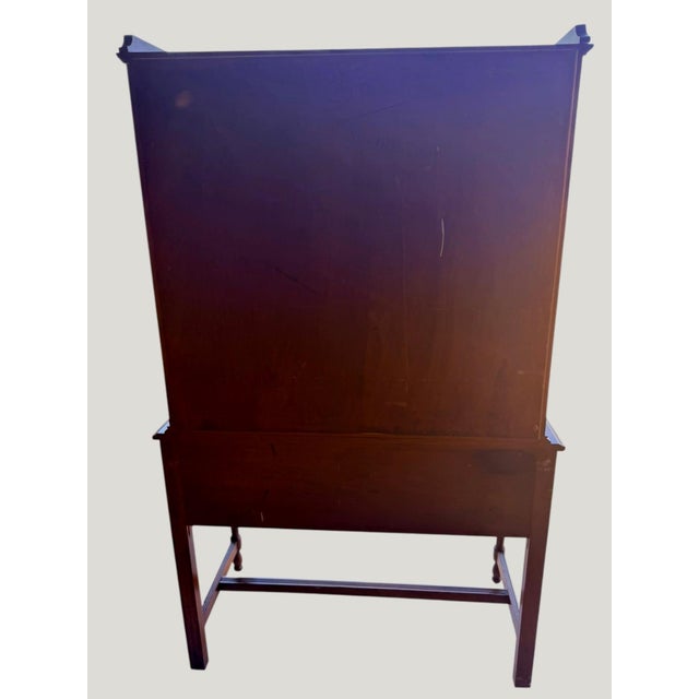 Elegant circa 1920s American Federal / Hepplewhite Revival china cabinet featuring refined Neoclassical styling and a warm...