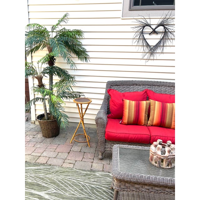 This mid-century, rattan and bamboo pedestal/plant stand is attributed to Franco Albini and was made and designed in...