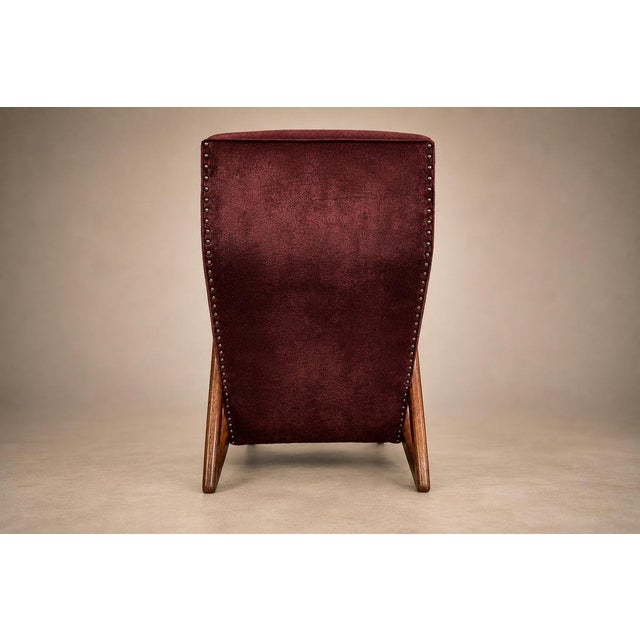 : A striking example of early Brazilian modernism, this sculptural lounge armchair, attributed to José Zanine Caldas,...