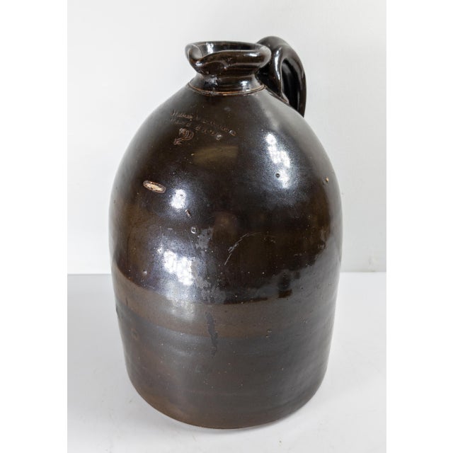 We are selling this Albany Slip Glazed stoneware jug from West Troy. This brown glaze typical of Albany Slip is applied to...