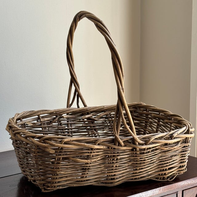 Offering a large and very beautiful vintage twig basket (circa early- to mid-20th century). Love the French randing, aged...