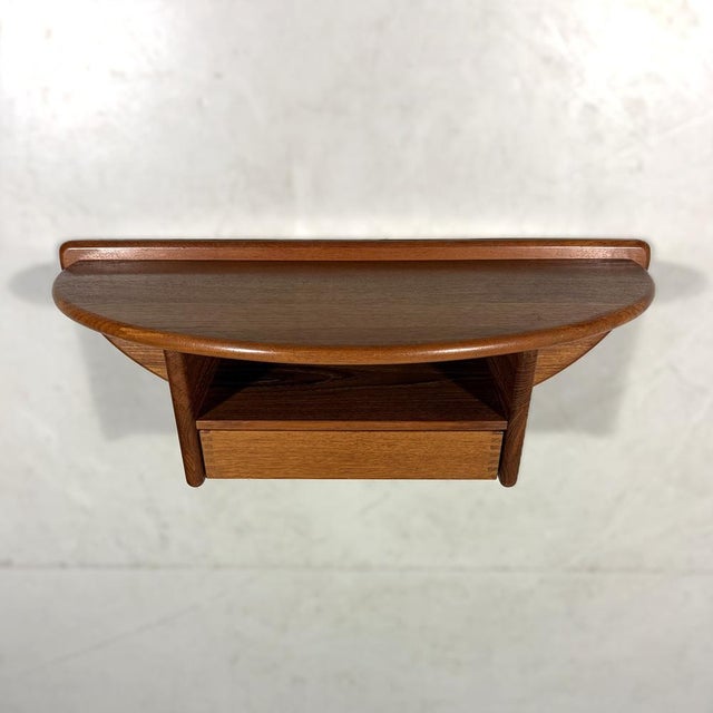 Very nice wall console by Kai Kristiansen for Vildbjerg Møbelfabrik, Denmark. Half-round shaped teak wood, 1 drawer with...
