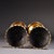 This is a matched pair of Chinese cloisonné gilt brass candlesticks. One pillar features a raised relief dragon, the other...