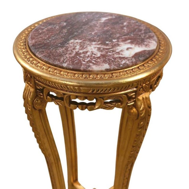 A wonderfully elegant pair of louis xvi–style giltwood pedestals, perfect for displaying urns, busts, bronzes or...