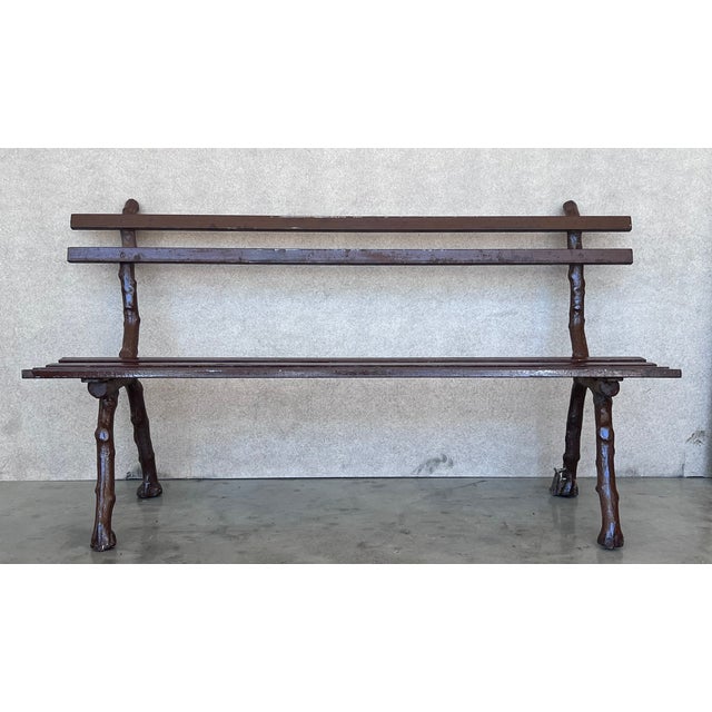 About the Item Stunning French Provincial garden bench. Striking French design from the Late 19th Century. The rustic leg...