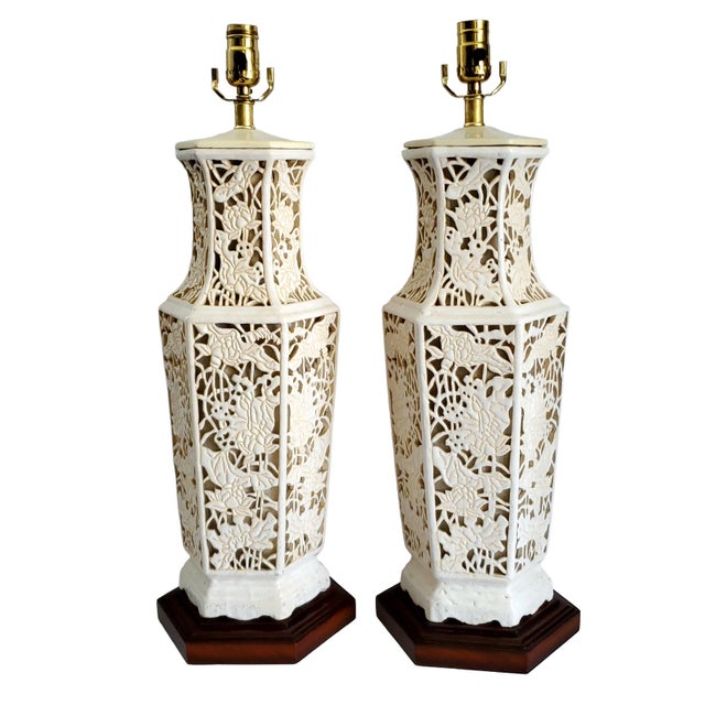 Offering a pair of extra large Early 20th Century reticulated Blanc De Chine porcelain table lamps with interior lights....