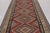 Made with handwoven wool circa 1950-1960, this 6x15 vintage flat-weave gallery runner Kilim is a particularly impressive...