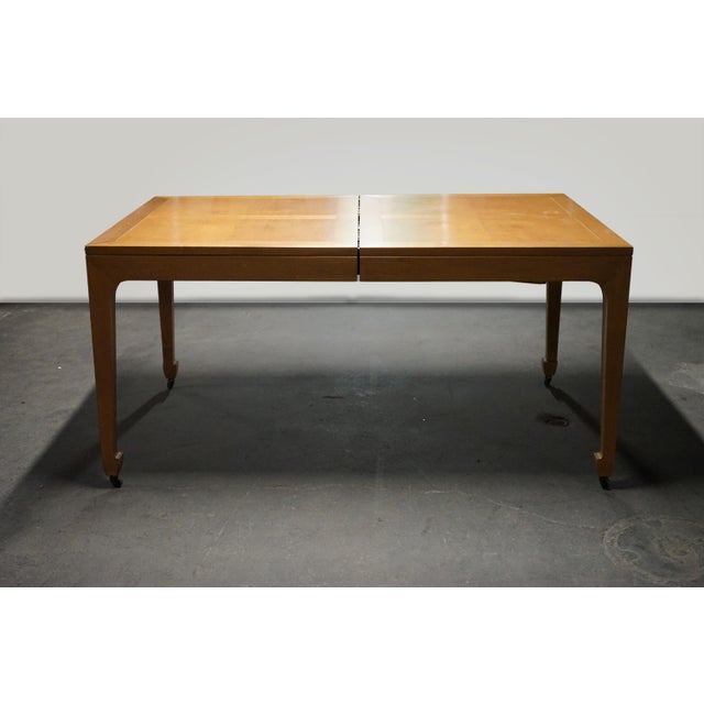 A timelessly designed dining table that Michael Taylor did for Baker Furniture. This table starts out as a rectangle but...