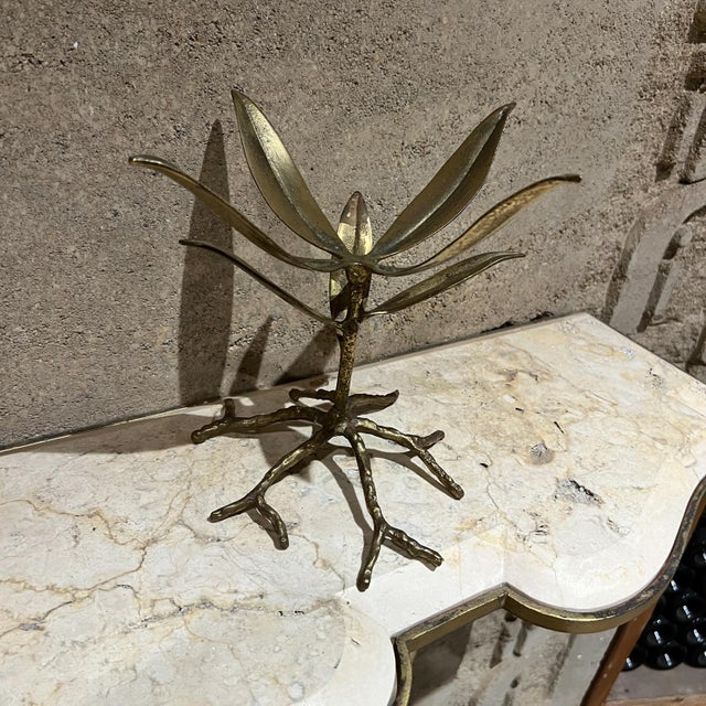 For your consideration, a 1970s brutalist brass gold leaf plant stand or bowl stand. Dimensions: 9.5" H x 10" diameter....
