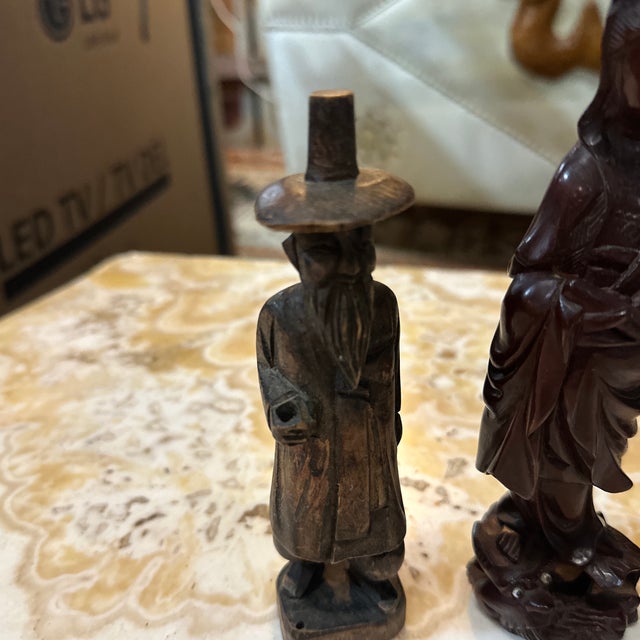Up for consideration is a beautiful vintage Asian style instant collection of wooden figurines and ship with a stand....