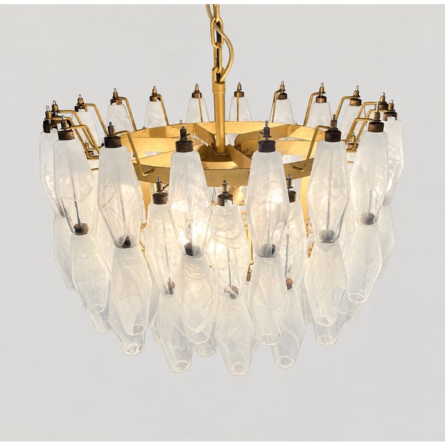 Alabaster white Murano glass chandelier with polyhedron elements arranged on multiple concentric levels. The light shade...