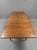 Bring mid-century elegance into your home with this stunning Scandinavian Teak Dining Table. The table features a...