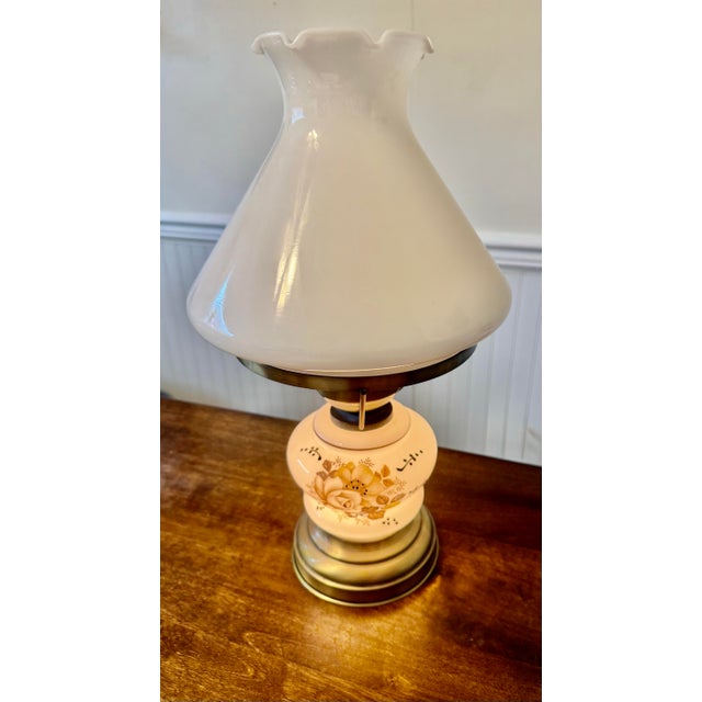 This lamp was designed to mimic the aesthetic of traditional oil lamps but is powered by electricity. It features a 3-way...