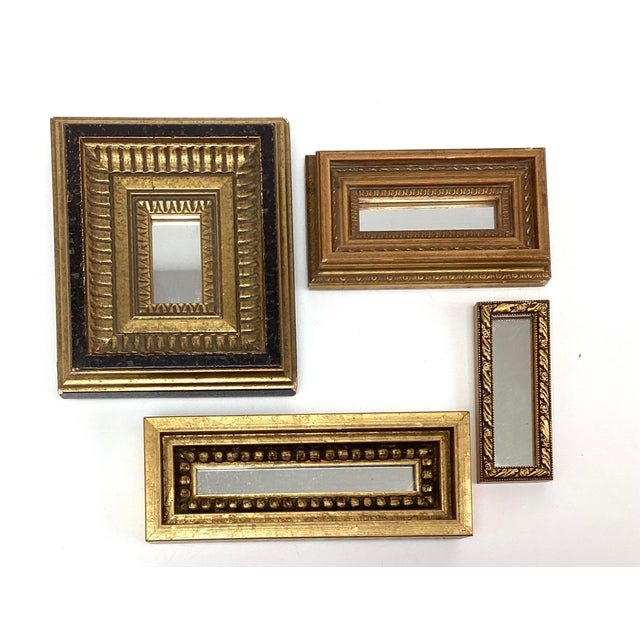 Charming lot of four miniature “Tom Thumb” carved wood mirrors, full art appeal. Each mirror features a delicately carved...